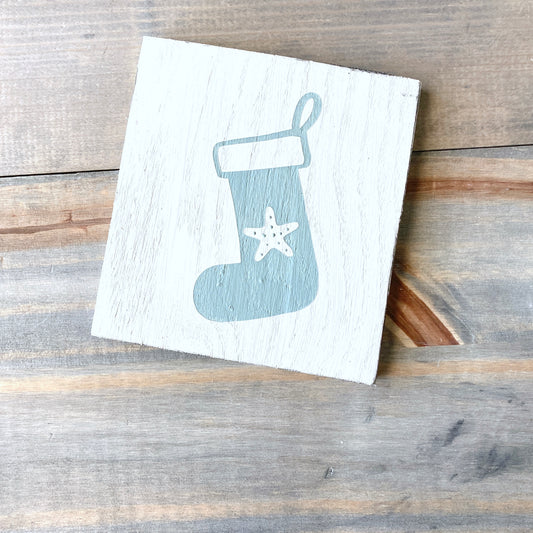 Coastal Christmas decor, Anchored Soul Designs starfish stocking sign, white background with sage green design