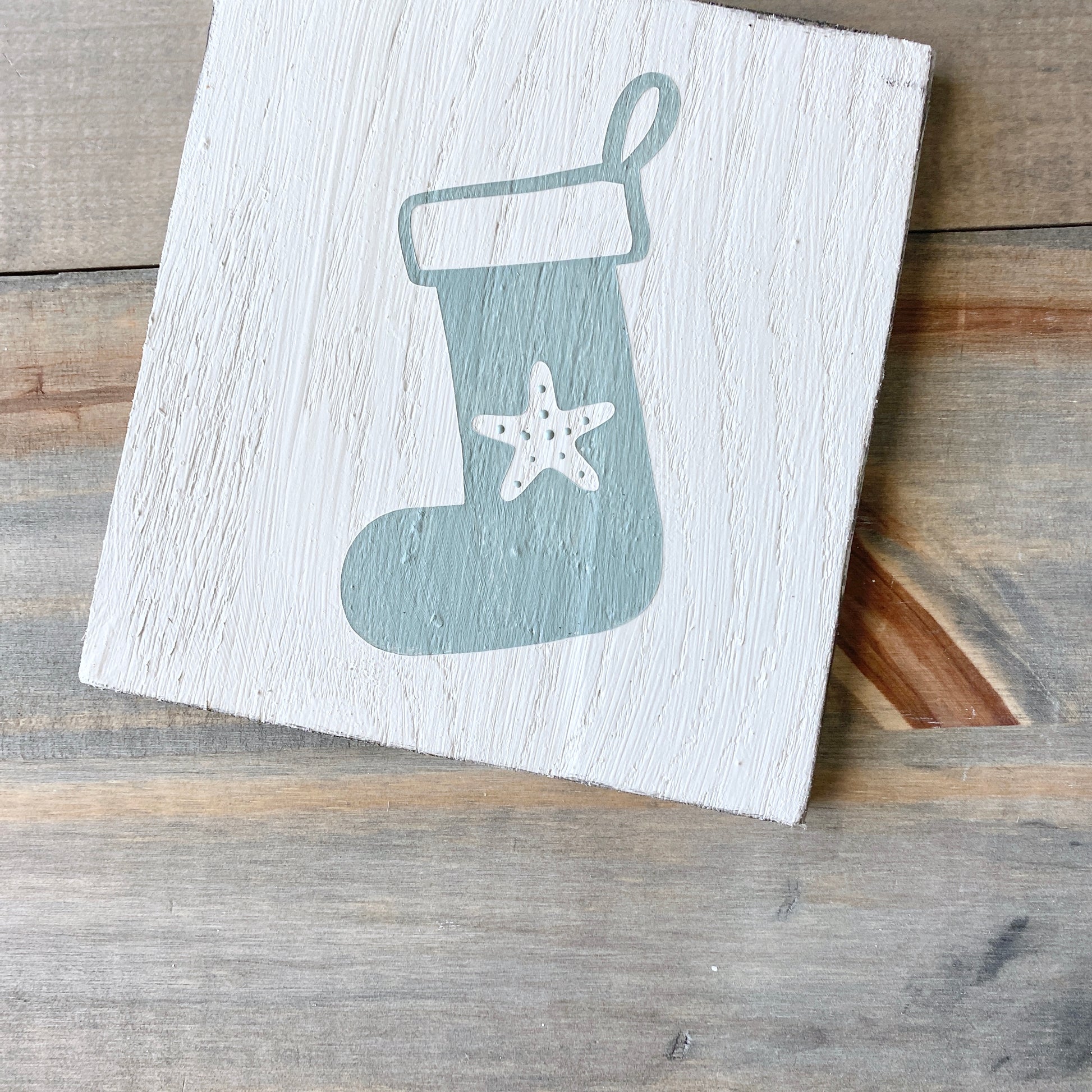 Coastal Christmas decor, Anchored Soul Designs starfish stocking sign, white background with sage green design