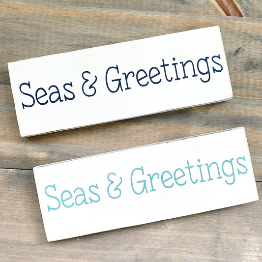 Coastal Christmas Decor, Anchored Soul Designs seas & greetings Christmas wood sign white background with navy and aqua design, beach house holiday decor coastal design