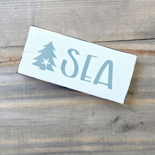Coastal Christmas Decor, Anchored Soul Designs Sea Christmas wood sign with small tree and starfish white background with sage green design, beach house holiday decor coastal design