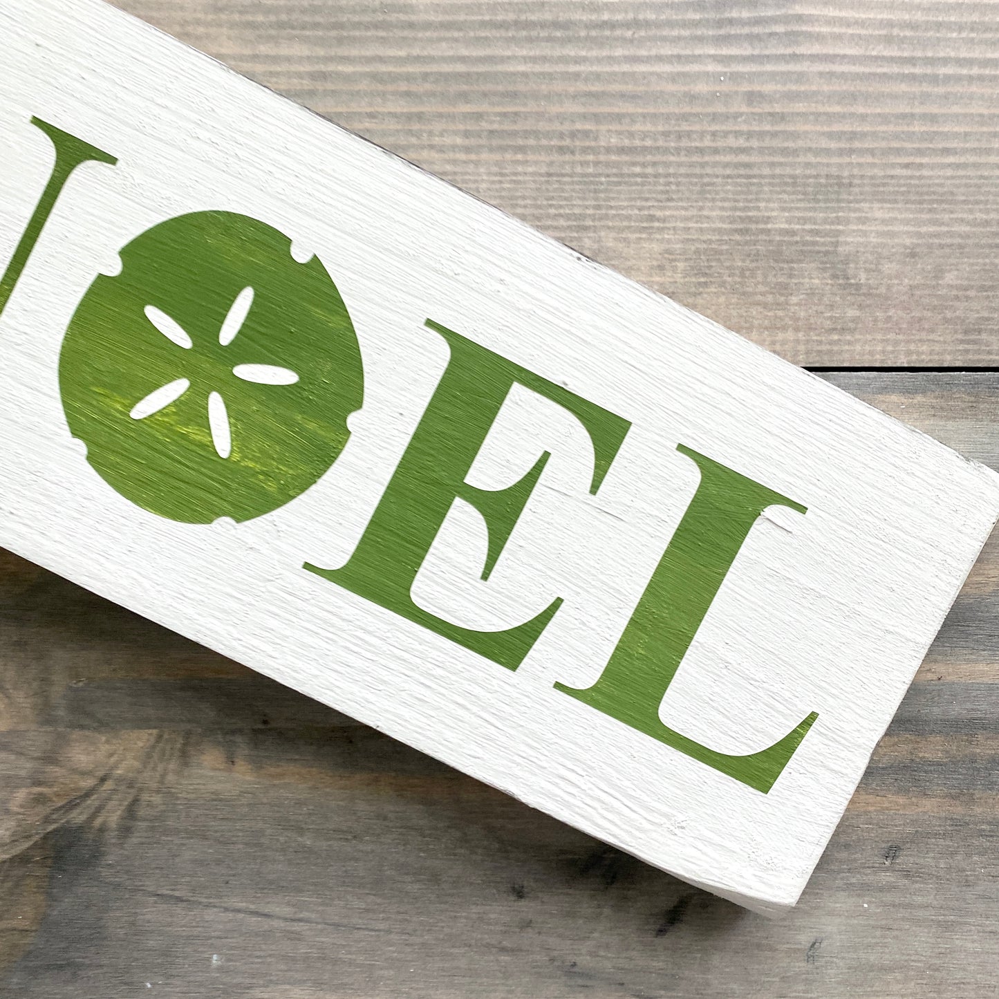 Coastal Christmas Decor, Anchored Soul Designs Noel Sand Dollar Christmas wood sign white background with green design, beach house holiday decor coastal design