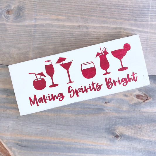Making spirits bright sign in red and white on a distressed wood background
