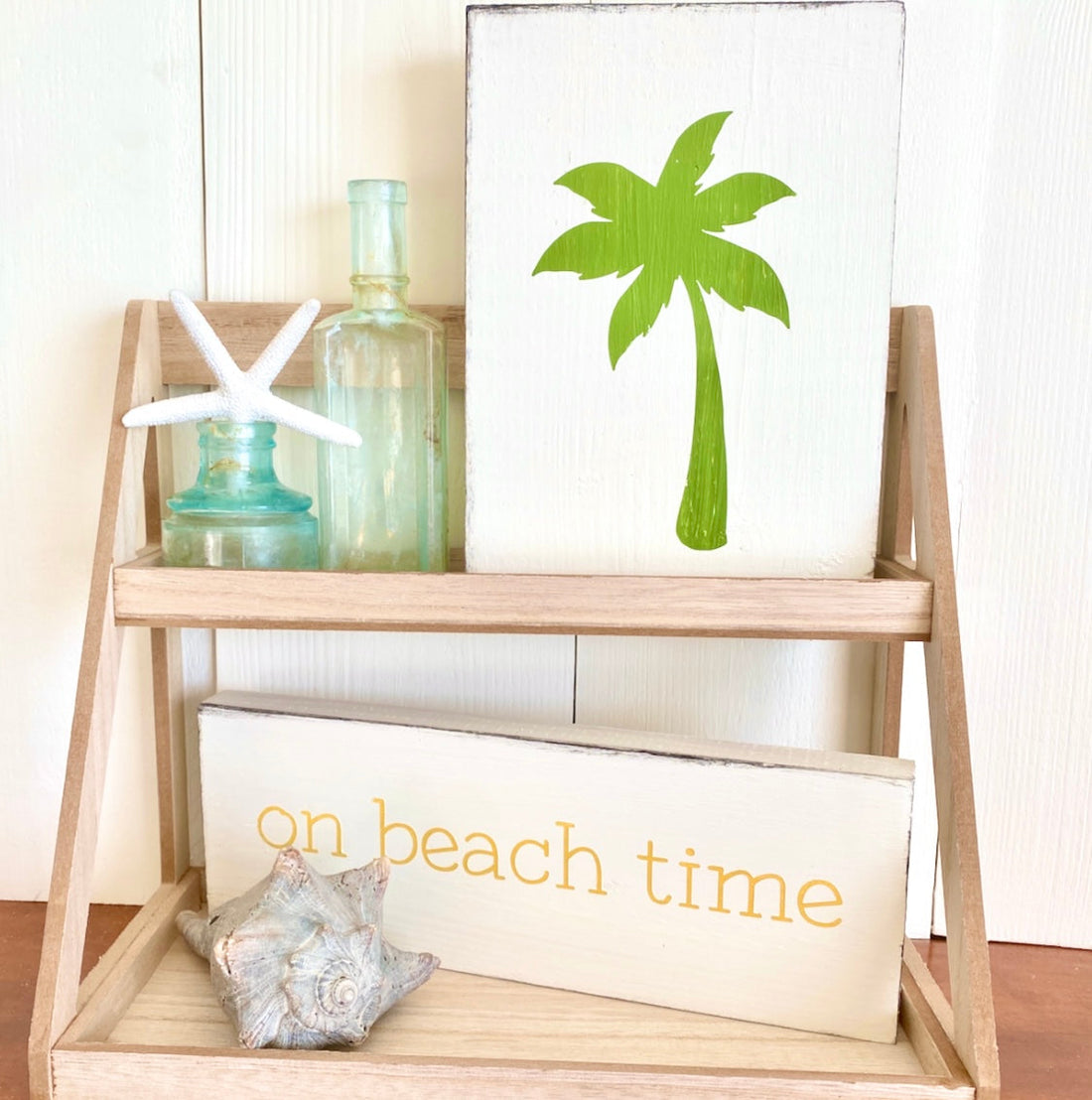 Handmade coastal home decor signs including ocean waves, sea turtle, and beach-inspired wood signs