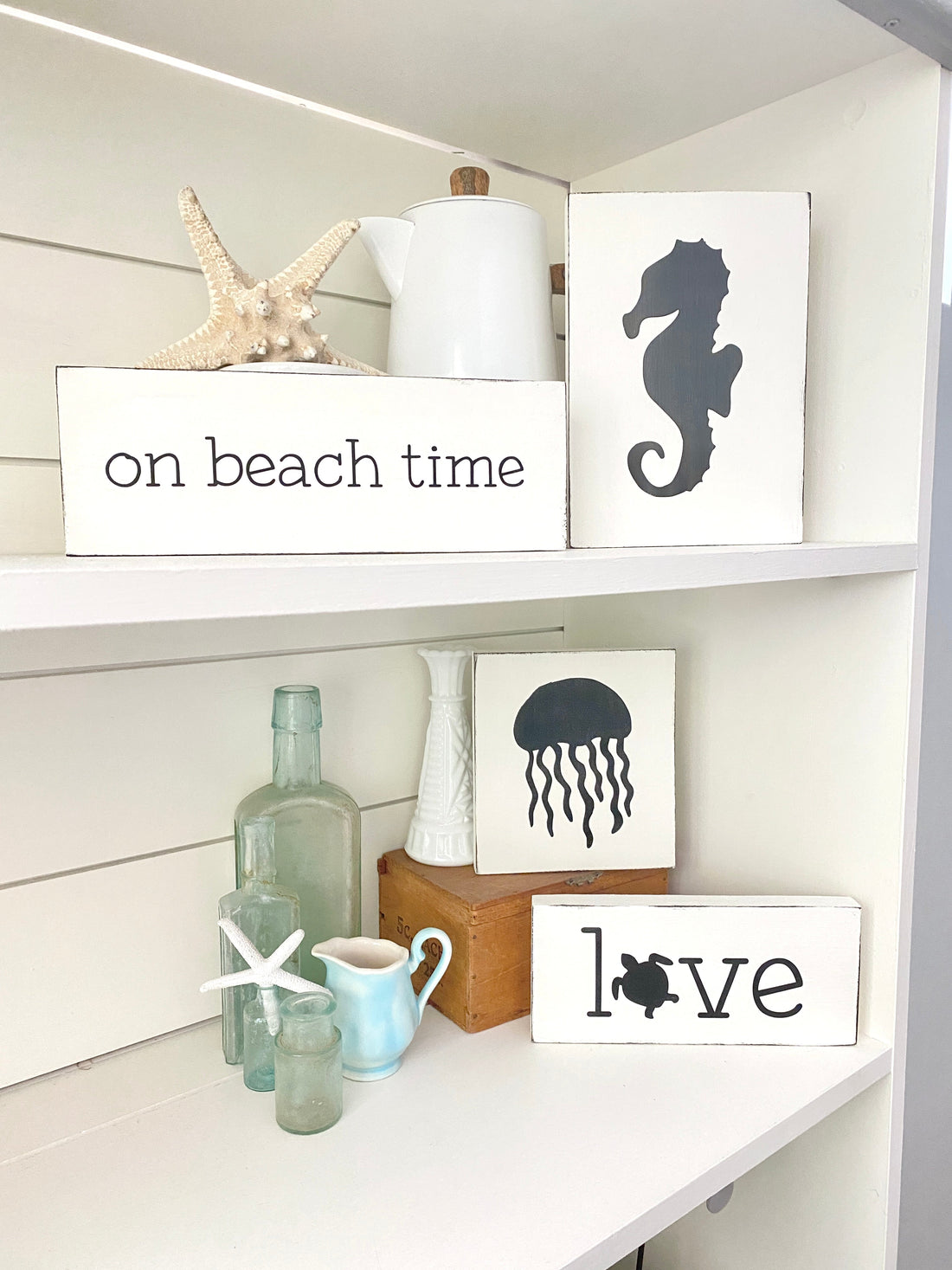 Coastal grandmother aesthetic with natural textures, greenery, and handmade coastal signs from Anchored Soul Designs