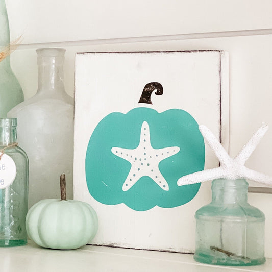 Coastal fall decor refresh with blue and white pumpkins, driftwood, and handmade signs from Anchored Soul Designs on Amelia Island
