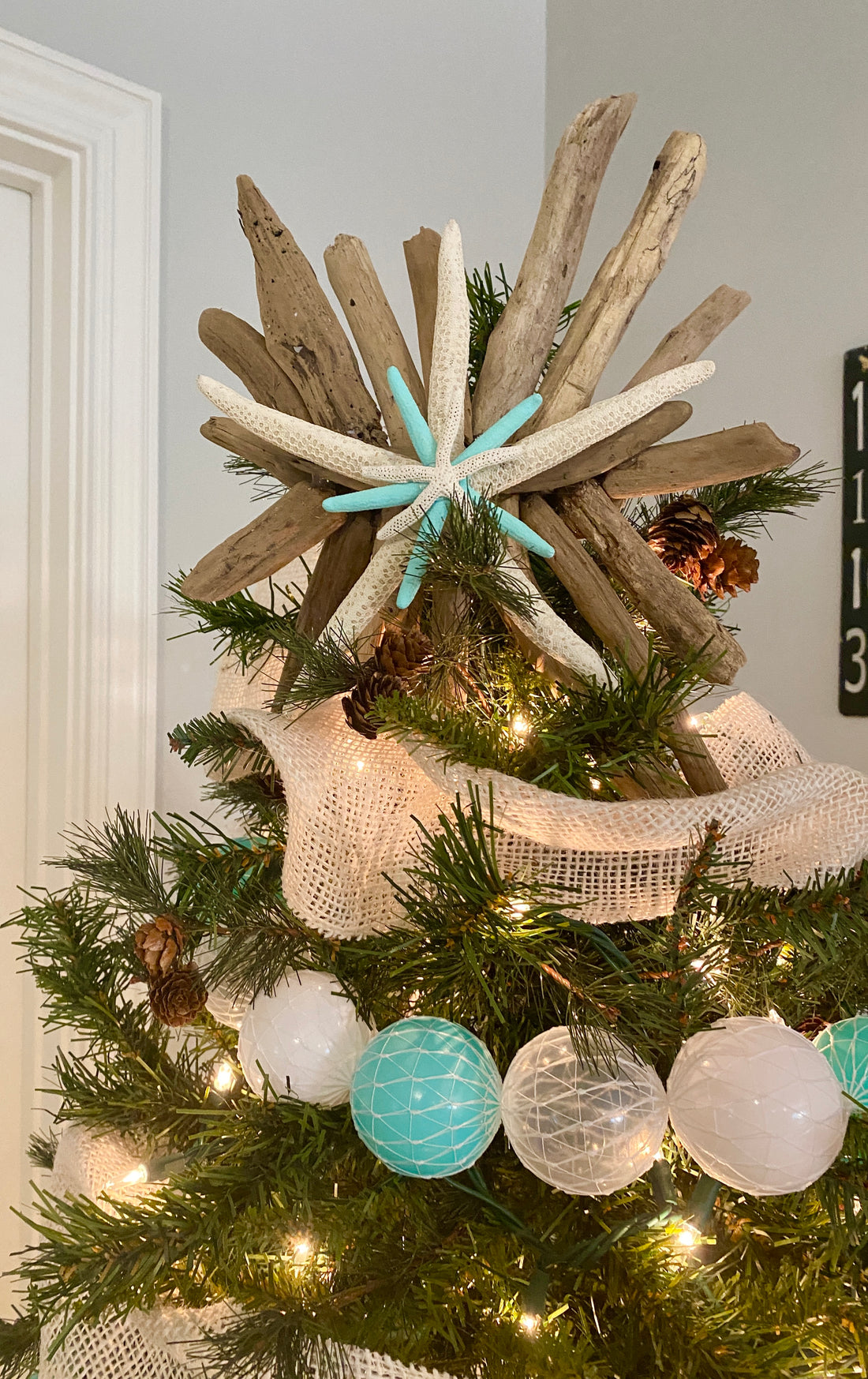DIY coastal tree topper with starfish and driftwood
