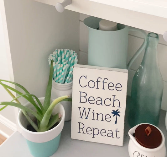 Coffee Beach Wine Repeat handmade coastal wood sign displayed in a beach house kitchen with coastal decor