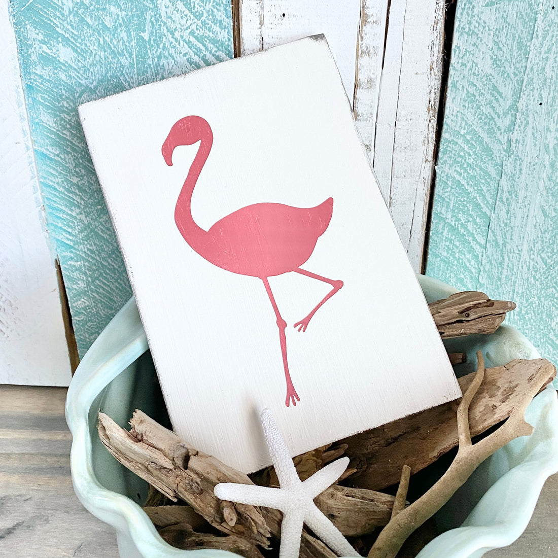 pink coastal decor that feels like a beach sunset, pink flamingo sign for coastal decorating