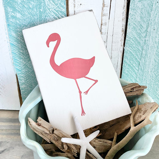 pink coastal decor that feels like a beach sunset, pink flamingo sign for coastal decorating