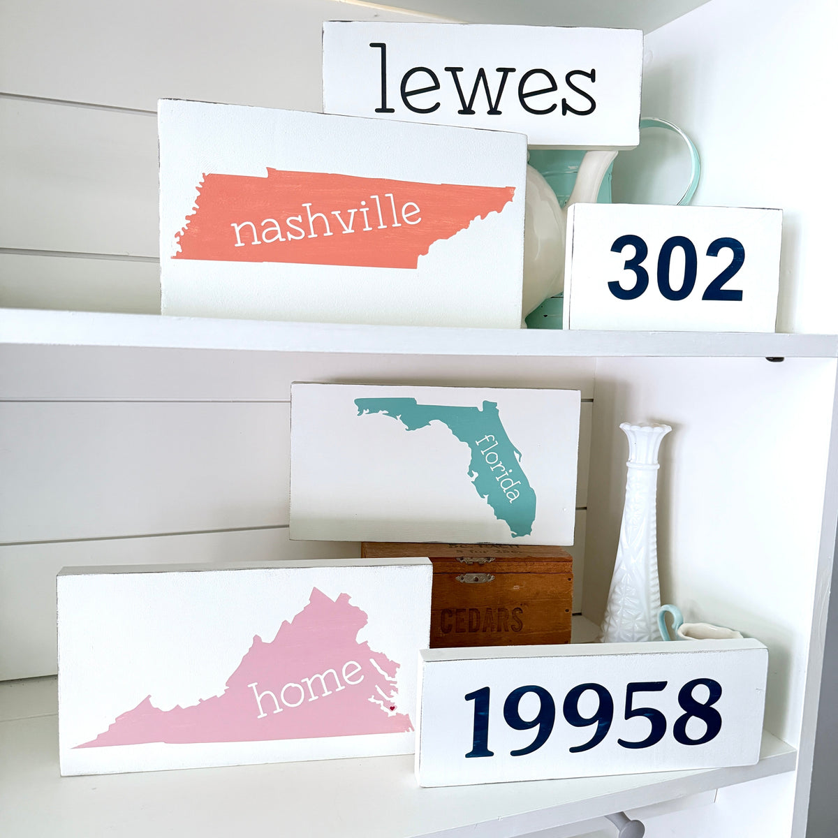 Handmade location signs including Home State Sign, Area Code Sign, Zip Code Sign, and Small Location Word Sign, hand-painted to order on Amelia Island Florida, personalized realtor closing gifts and new homeowner gifts