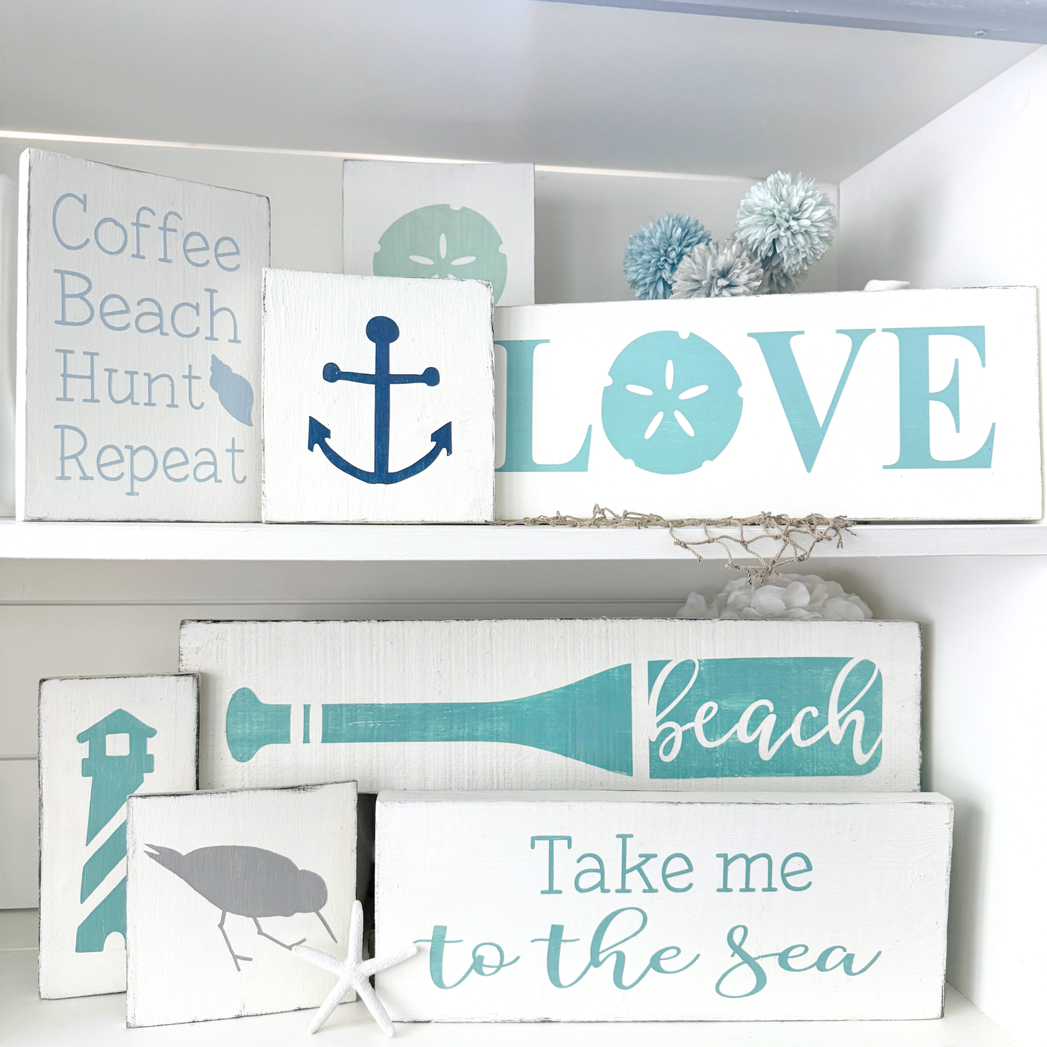 Handmade coastal cottage signs displayed on a shelf, beach house home decor by Anchored Soul Designs