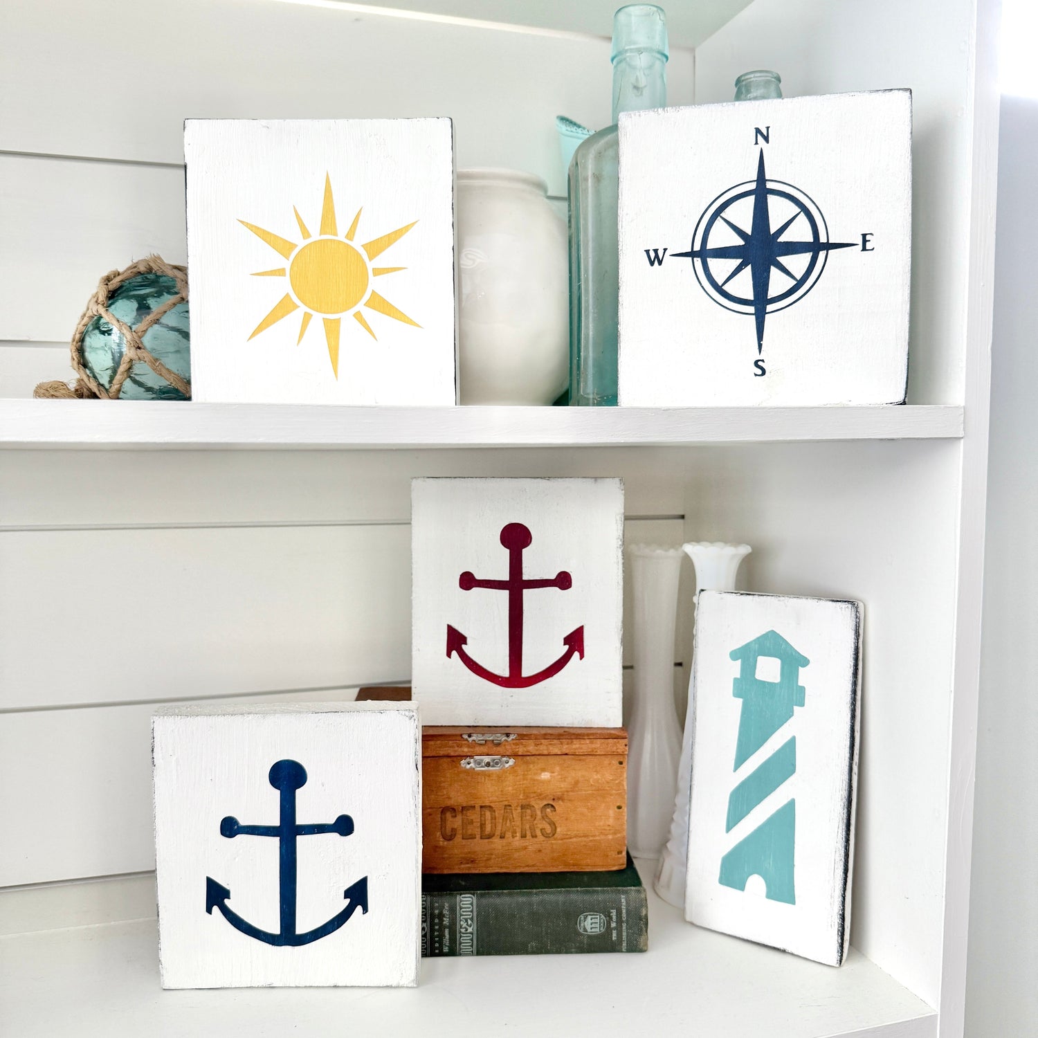Lake icons signs featuring classic lake life symbols like paddles, boats, and water activities for lakehouse decor