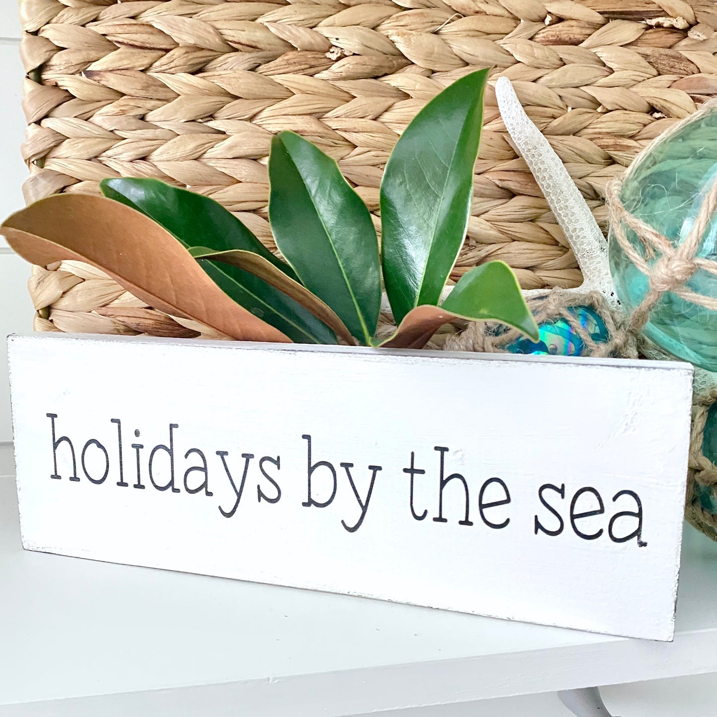 Holidays by the sea sign