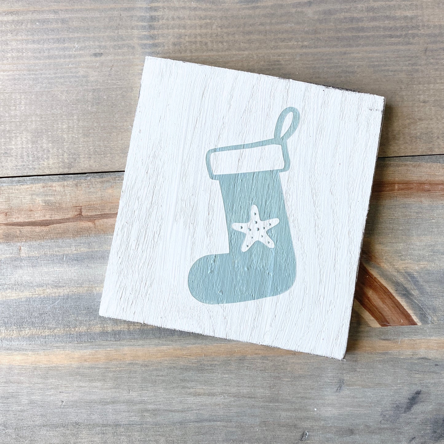 Coastal Christmas decor, Anchored Soul Designs starfish stocking sign, white background with sage green design