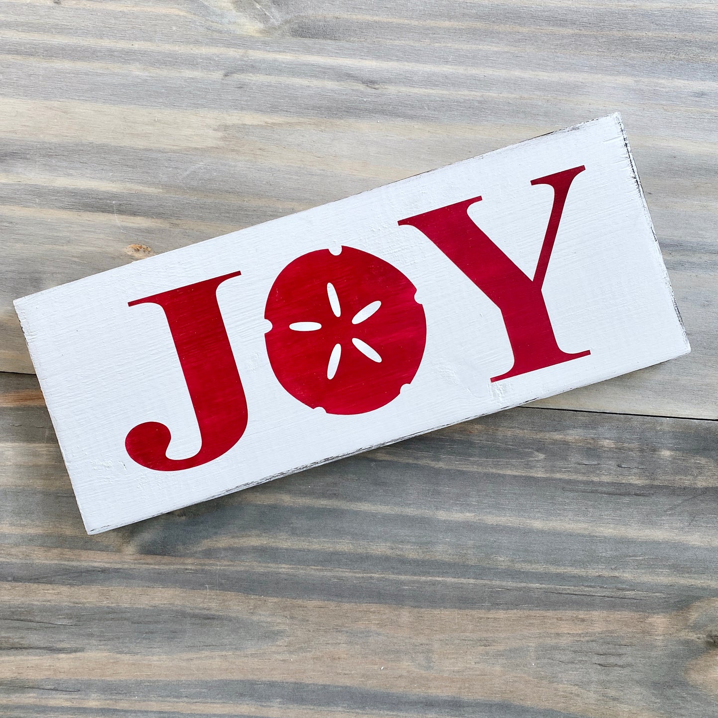 Coastal Christmas Decor, Anchored Soul Designs Joy Sand Dollar Christmas wood sign white background with red design, beach house holiday decor coastal design