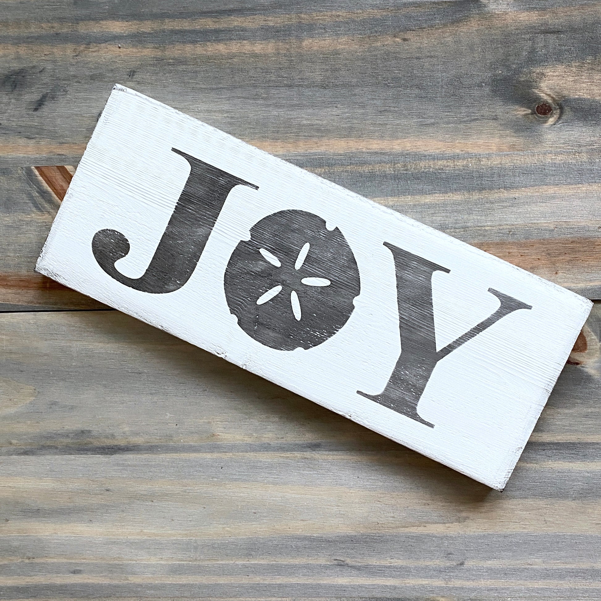 Coastal Christmas Decor, Anchored Soul Designs Joy Sand Dollar Christmas wood sign white background with black design, beach house holiday decor coastal design