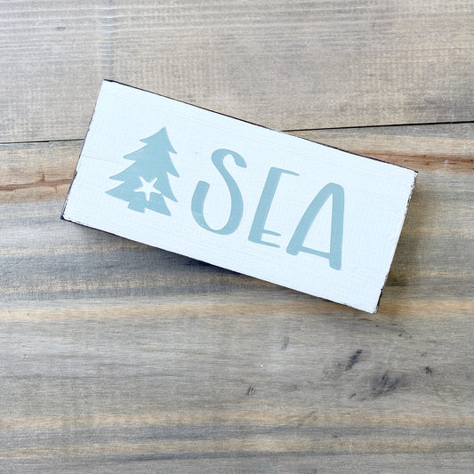 Coastal Christmas Decor, Anchored Soul Designs Sea Christmas wood sign with small tree and starfish white background with sage green design, beach house holiday decor coastal design