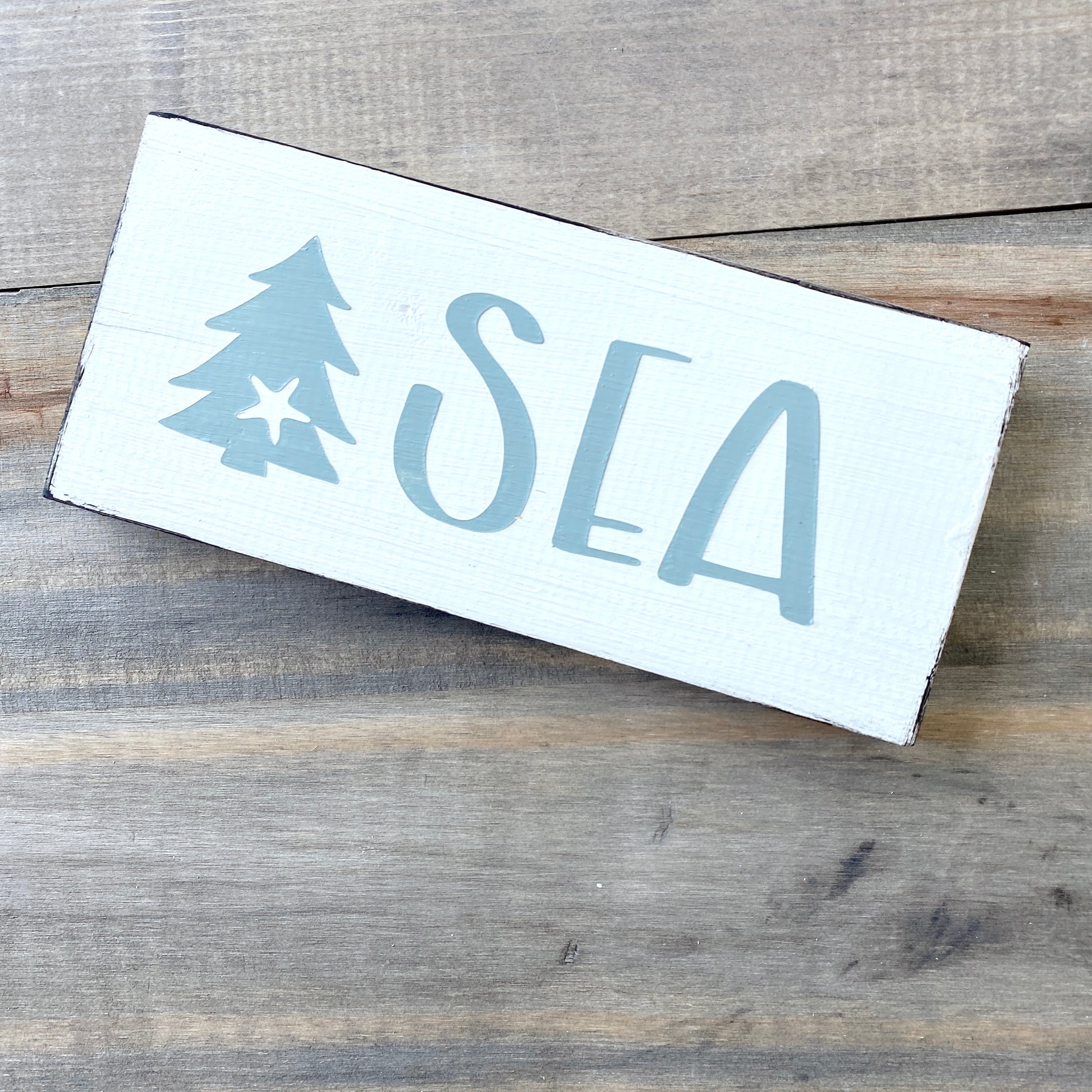 Coastal Christmas Decor, Anchored Soul Designs Sea Christmas wood sign with small tree and starfish white background with sage green design, beach house holiday decor coastal design