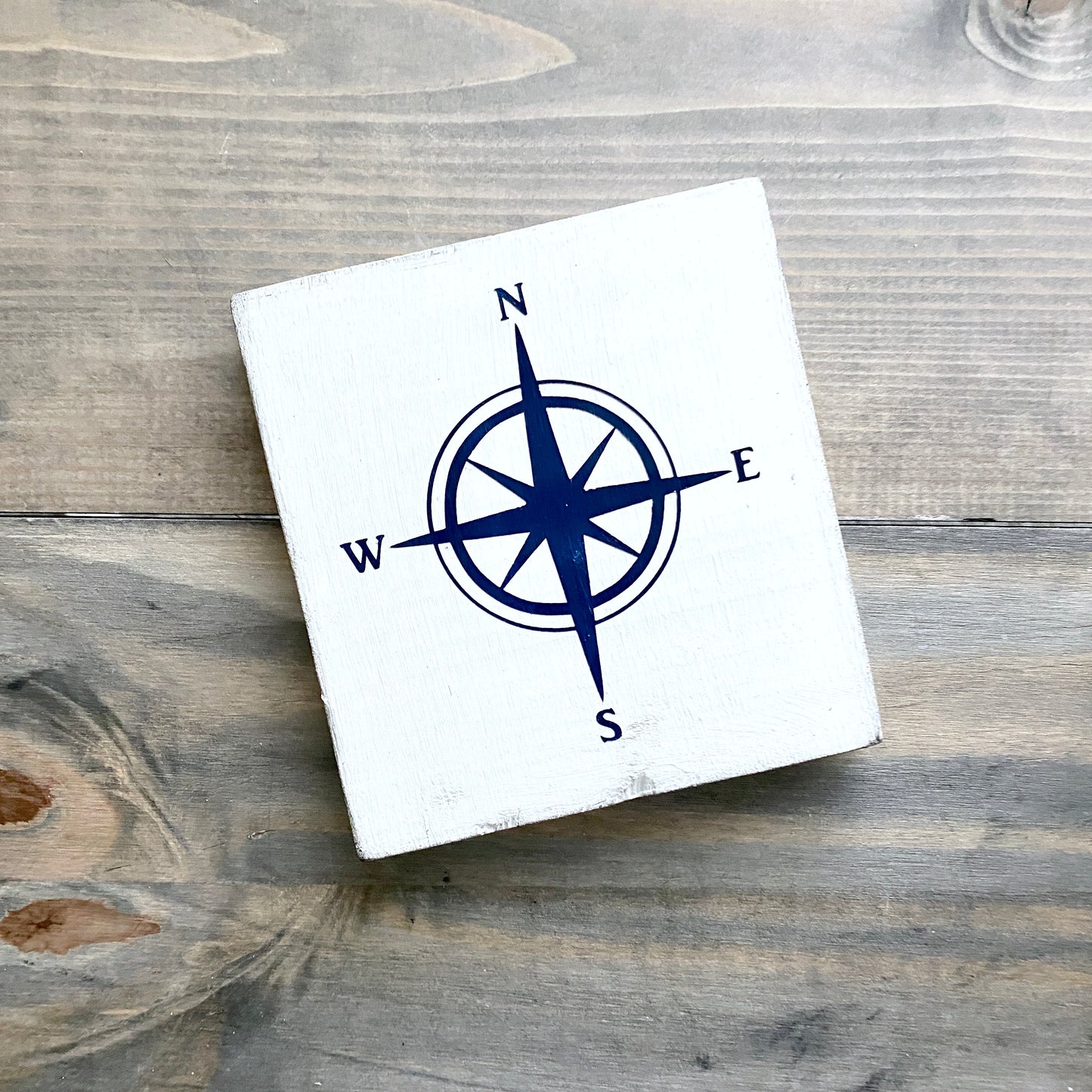 Coastal compass in navy beach house decor sign