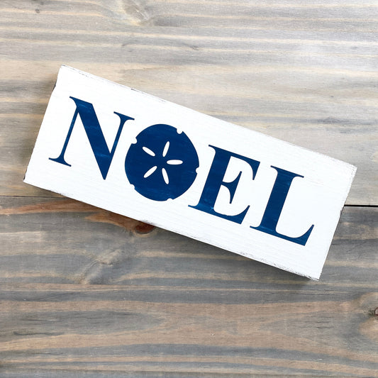 Coastal Christmas Decor, Anchored Soul Designs Noel Sand Dollar Christmas wood sign white background with navy design, beach house holiday decor coastal design