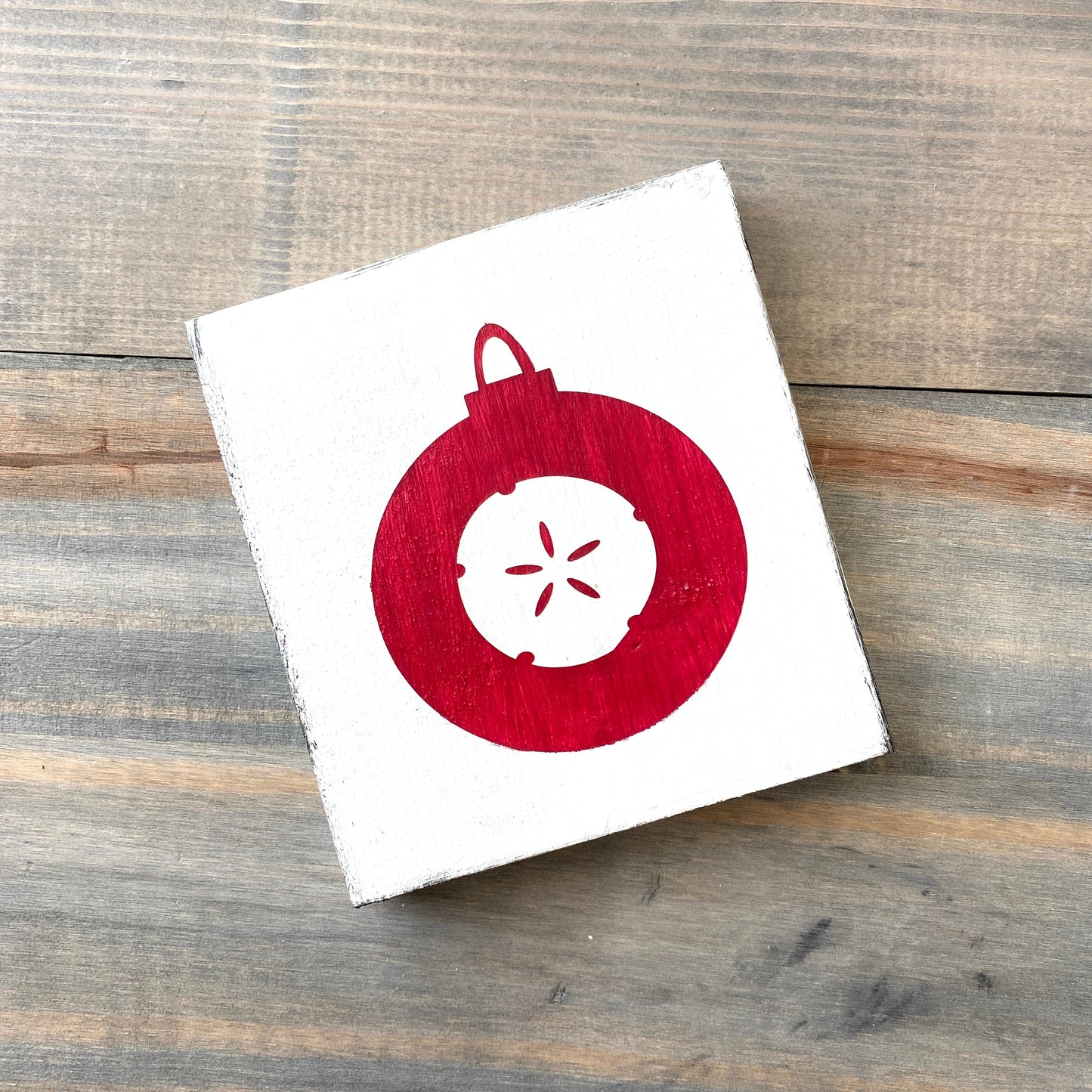 Coastal Christmas Decor, Anchored Soul Designs Sand Dollar Ornament wood sign white background with red design, beach house holiday decor coastal design