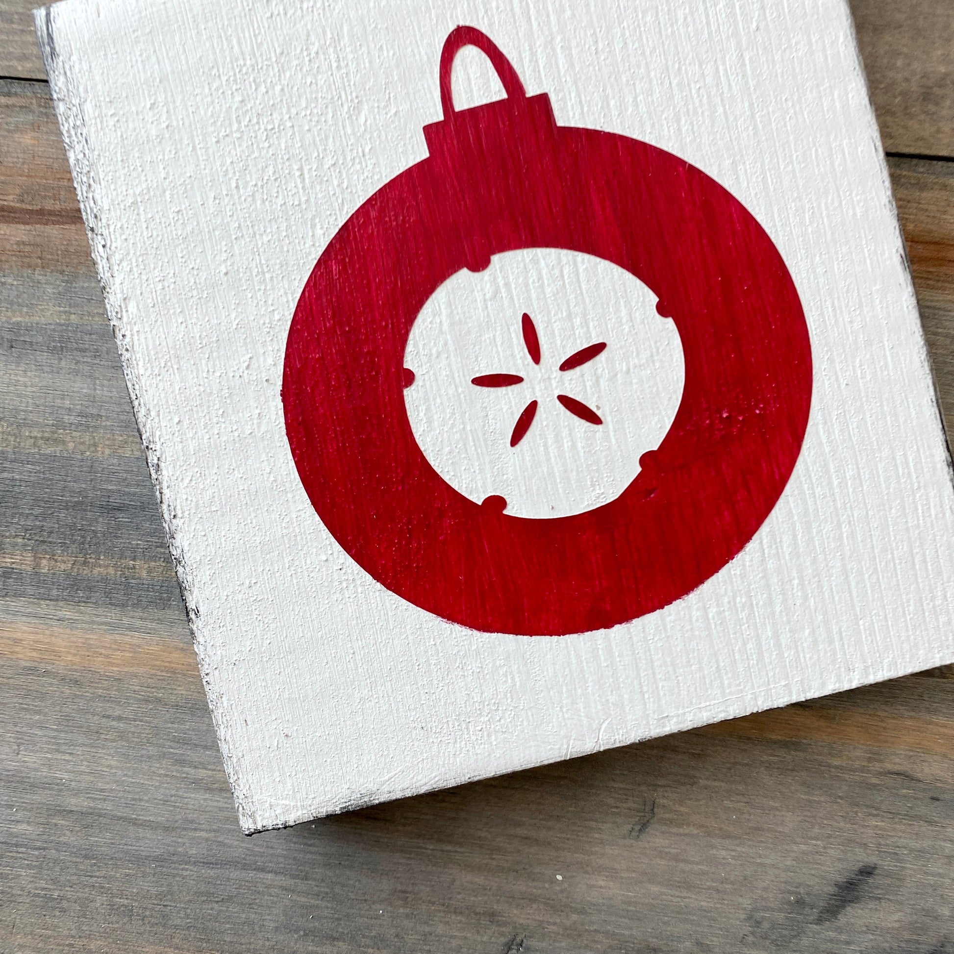 Coastal Christmas Decor, Anchored Soul Designs Sand Dollar Ornament wood sign white background with red design, beach house holiday decor coastal design